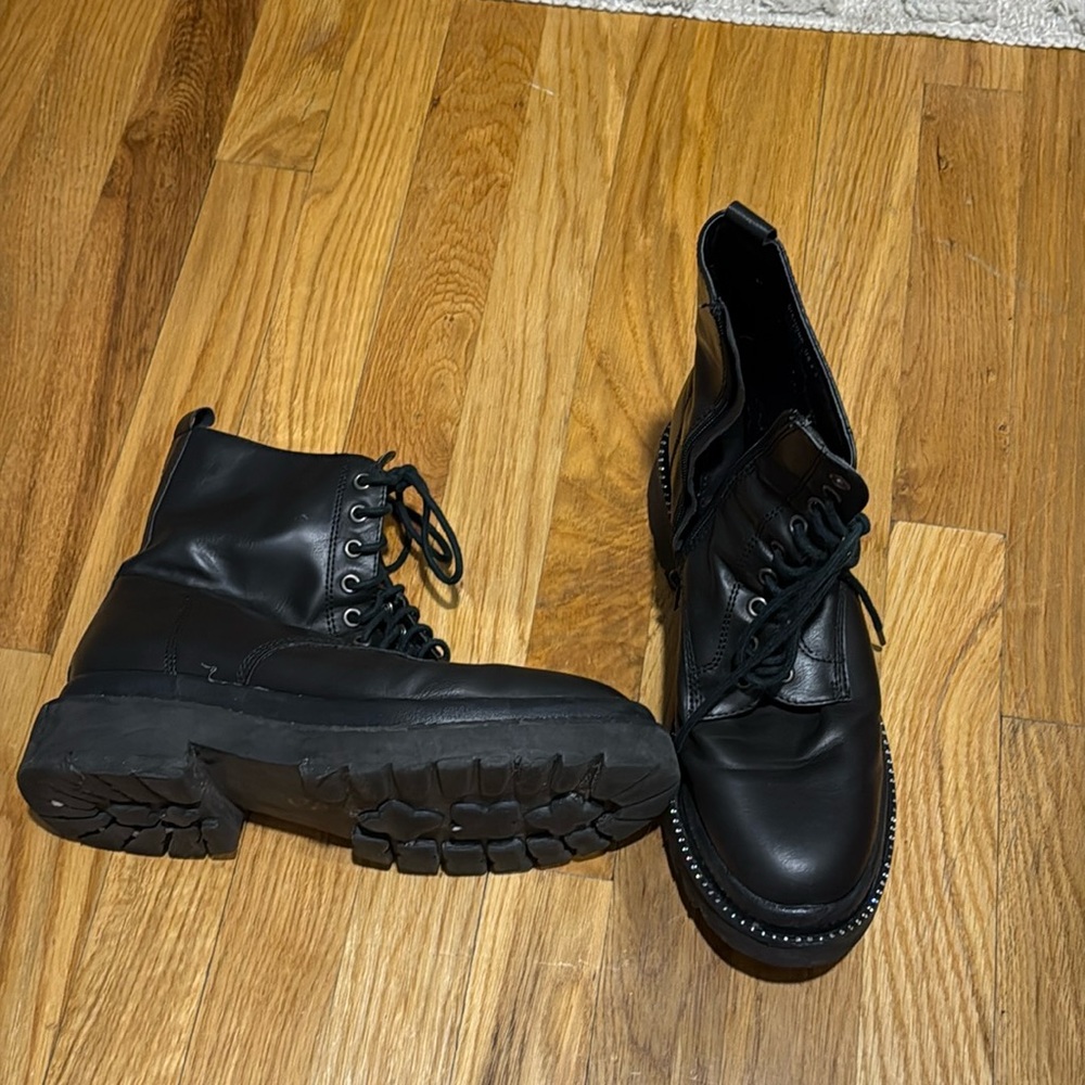 Black leather combat boots with rhinestone trim